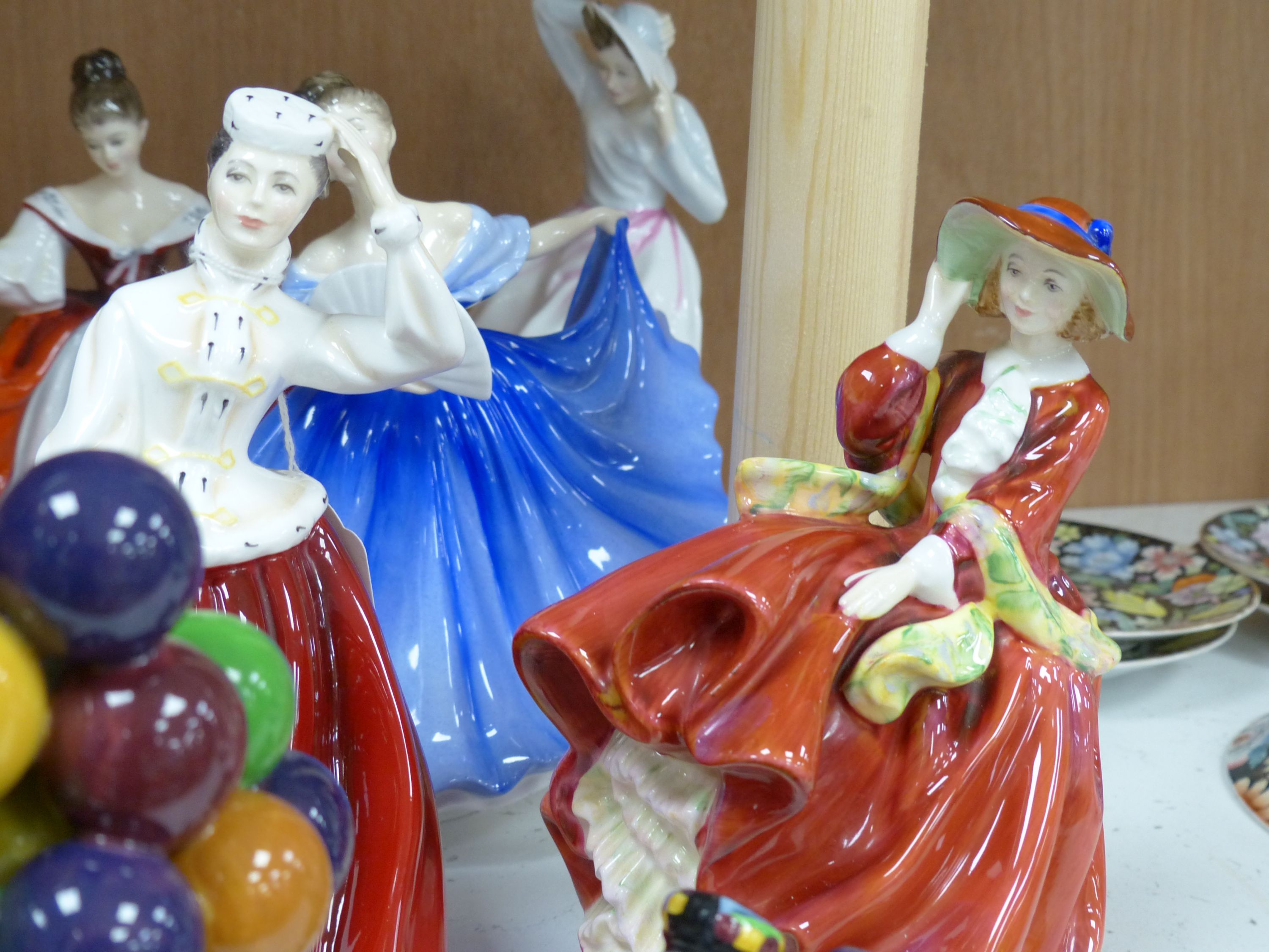 Ten Royal Doulton figurines, including 'Sara', 'The Judge', 'The Old Balloon Seller', 'Elaine' and others